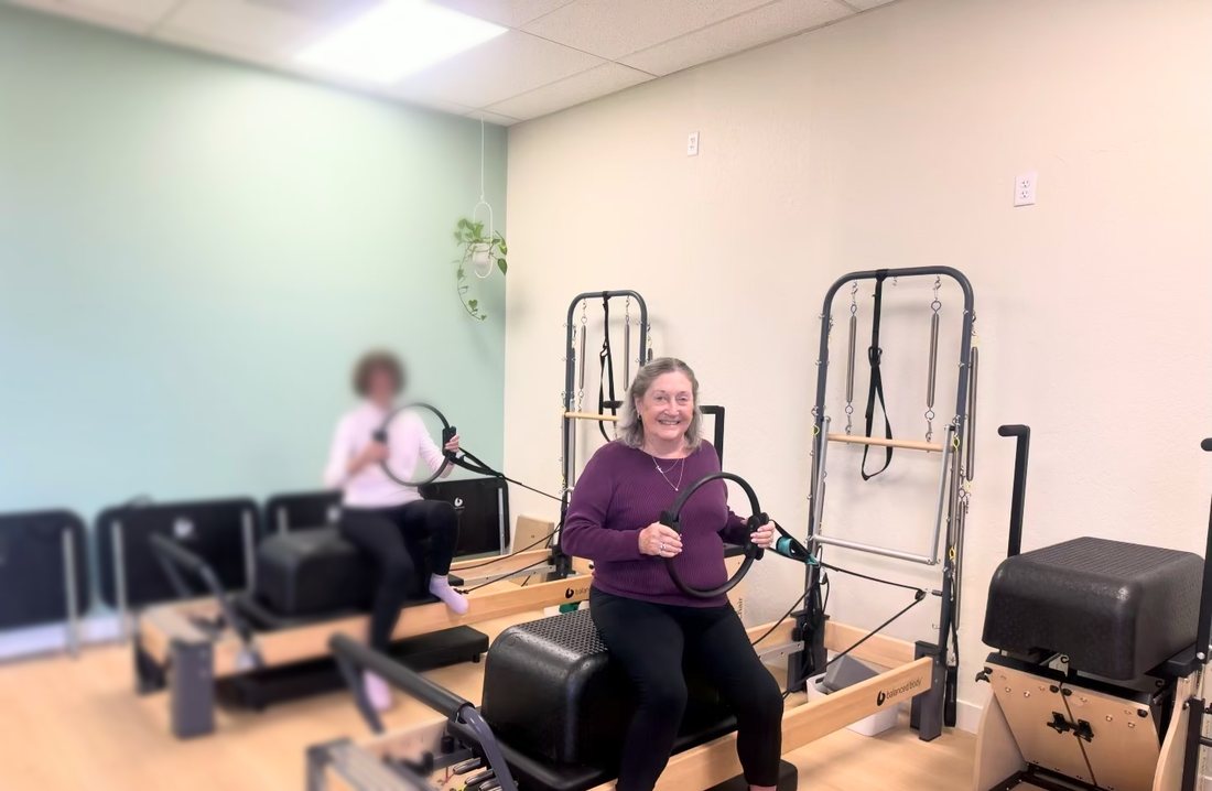 Clients using magic circles on the reformers at Aloe Pilates